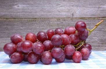 Grapes on wooden background