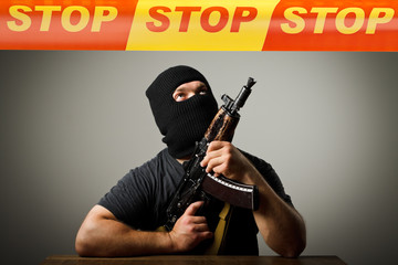 Man with gun and STOP line.