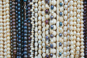 Pearl beads of various colors for sale.