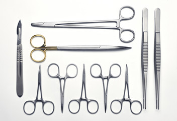 Set of various surgical instruments on a white background