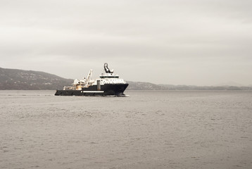 Fototapeta premium Cargo vessel is coming to port