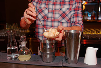 Fototapeta na wymiar Bartender is making a cocktail with leechee