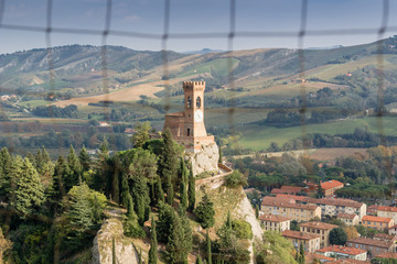 clock tower through medieval window