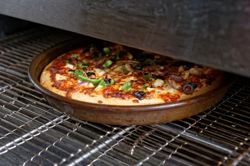 Foto op Plexiglas Pizza being baked in industrial oven © Kondor83