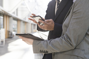 Businessmen have an electronic terminal