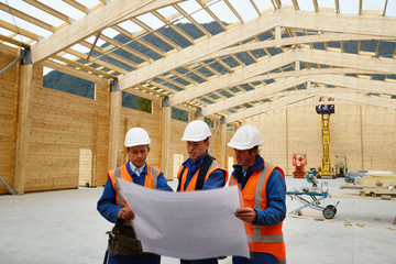 builders study the plan