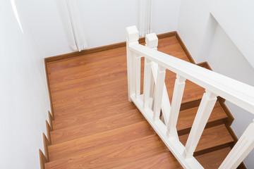 Fototapeta na wymiar wooden staircase made from laminate wood in white modern house
