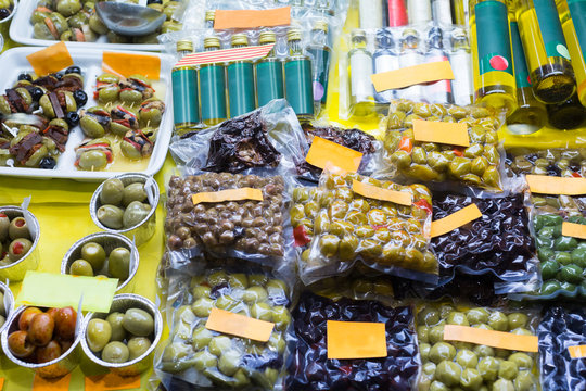 Market counter with olives and olive products