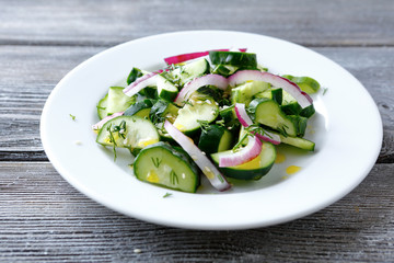 Salad with fresh cucumbers and onions