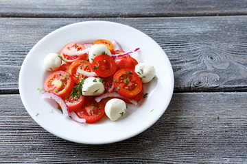 Vegetable salad with slices of cheese