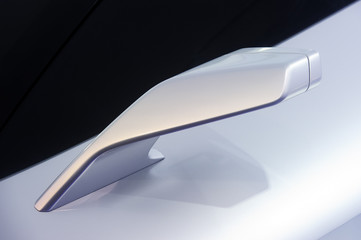 Rear view mirror. Side of concept sport racing silver car.