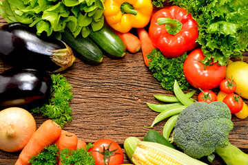 Vegetables and fruits on old wooden background