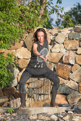 Young woman doing shamanic dance in nature