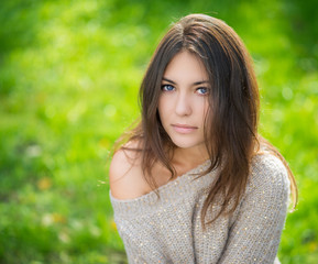 Fototapeta premium Portrait of young beautiful woman in sweater.