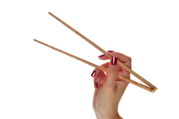 Woman hands holding chopsticks isolated on white