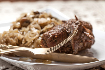 Beef roulade with cabbage.