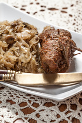 Beef roulade with cabbage.