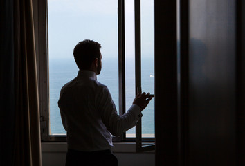 silhouette of young Italian groom before marriage