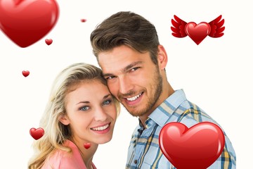 Composite image of attractive couple smiling at camera