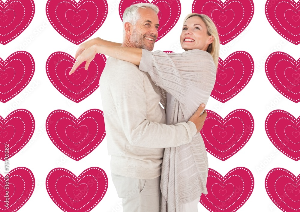 Poster Composite image of happy couple standing and hugging