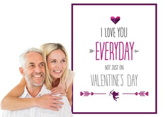 Composite image of happy man giving his partner a piggy back
