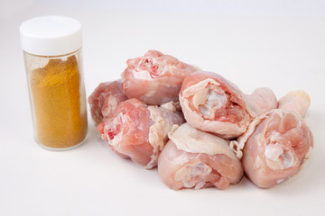 Raw chicken legs with curry