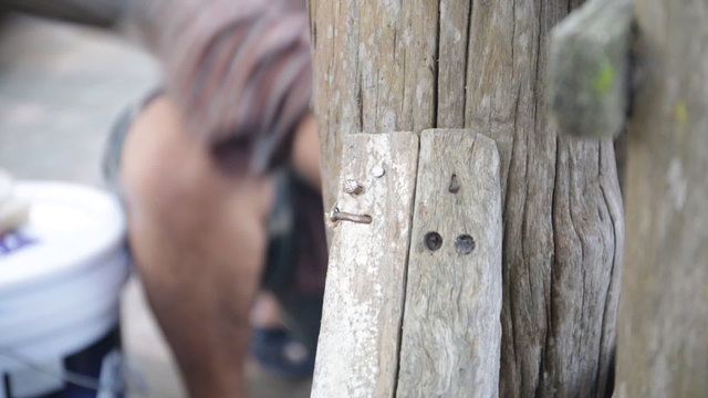 Closeup of Carpenter use equipment to repare the furniture