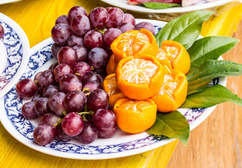 mixed set of fresh raw ripe fruits orange and grape