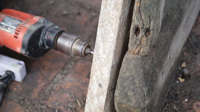 Closeup of Carpenter use equipment to repare the furniture