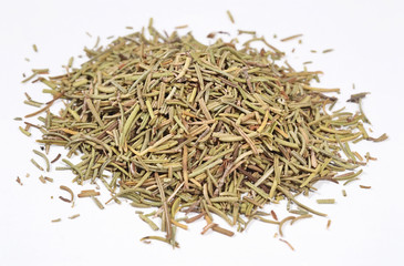 Heap of dried rosemary on a white