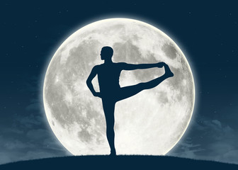 Obraz na płótnie Canvas man practicing yoga at full moon