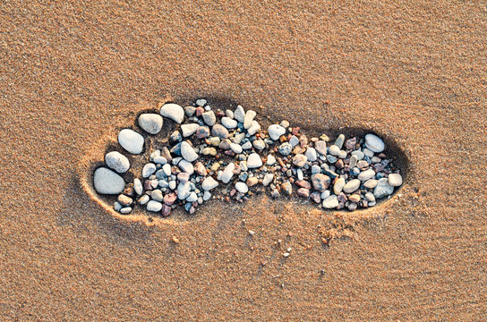 Footstep on sandy beach
