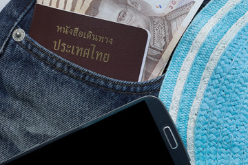 Closeup of money and passport in jeans