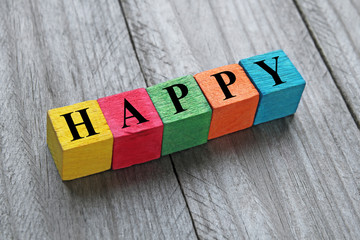 word happy on colorful wooden cubes