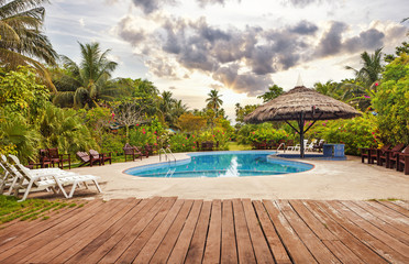 Resort swimming pool with empty plank board