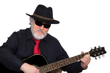 Obraz premium Senior is playing the guitar isolated on white