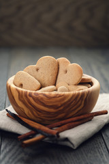 heart cookies for valentines day in olive bowl on wood table