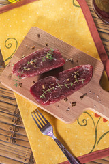 Raw beef tenderloin with spices
