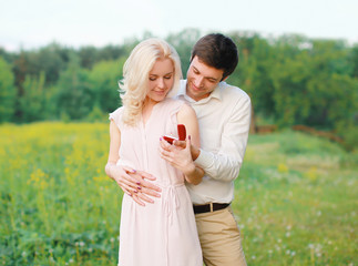 Love, relationships, wedding and couple concept - man proposing