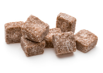 Brown lump cane sugar cube isolated on white background cutout