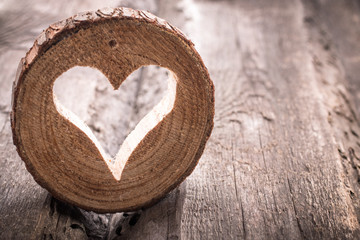 Light  heart on rustic wooden background
