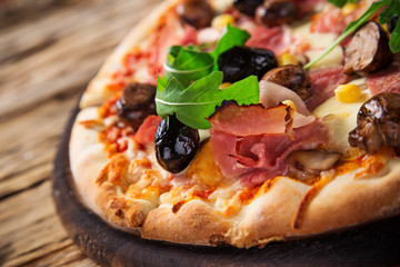 Delicious italian pizza served on wooden table