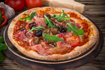 Delicious italian pizza served on wooden table
