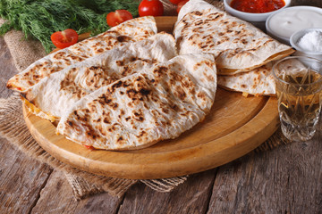 Quesadilla with sour cream and tomato sauce horizontal