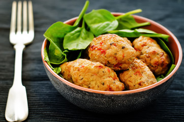baked meatballs with pepper and spinach