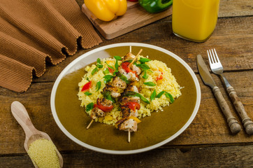 Couscous with vegetables and chicken skewer