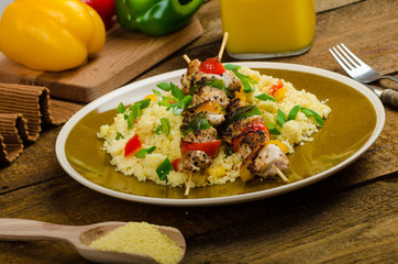 Couscous with vegetables and chicken skewer