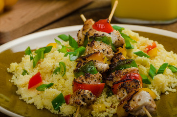Couscous with vegetables and chicken skewer