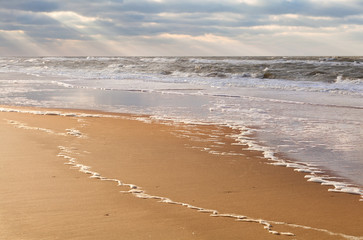sunbeams over North sea beach