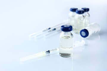Vaccine in vial with syringe